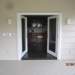 Exterior View of a Double Set of Retracted Screen Doors installed on French Doors in Office