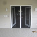 Exterior View of a Double Set of Open Retractable Screen Doors installed on French Doors in Office Point Dume, Malibu