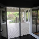 Interior View of a Double Set of Open Retractable Screen Doors installed on French Doors in Office in Point Dume, Malibu | Screen door service in The Valley