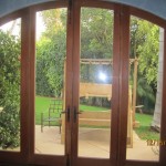 Double Set of Arched Screen Doors in Kitchen