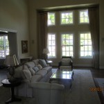 Large window screen panels installed in living room area