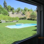 Large window panel overlooking pool