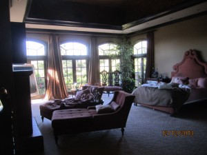 Installation of arched screen panel for inswinging arched oak wood french doors in Studio City home | Brentwood Arched Window and Doors