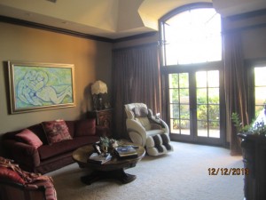 Arched door panels installed on double french doors in master bedroom