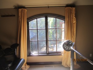 Screen arched panel installation in music room | Brentwood Arched Window and Doors