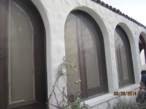 Studio City installation of arched screen panel for inswinging arched oak wood french doors | Brentwood Arched Window and Doors