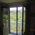 Closed set of retractable screen doors in Topanga