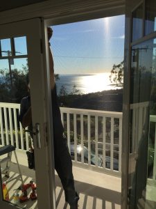 Malibu home arched window screen replacement balcony ocean view